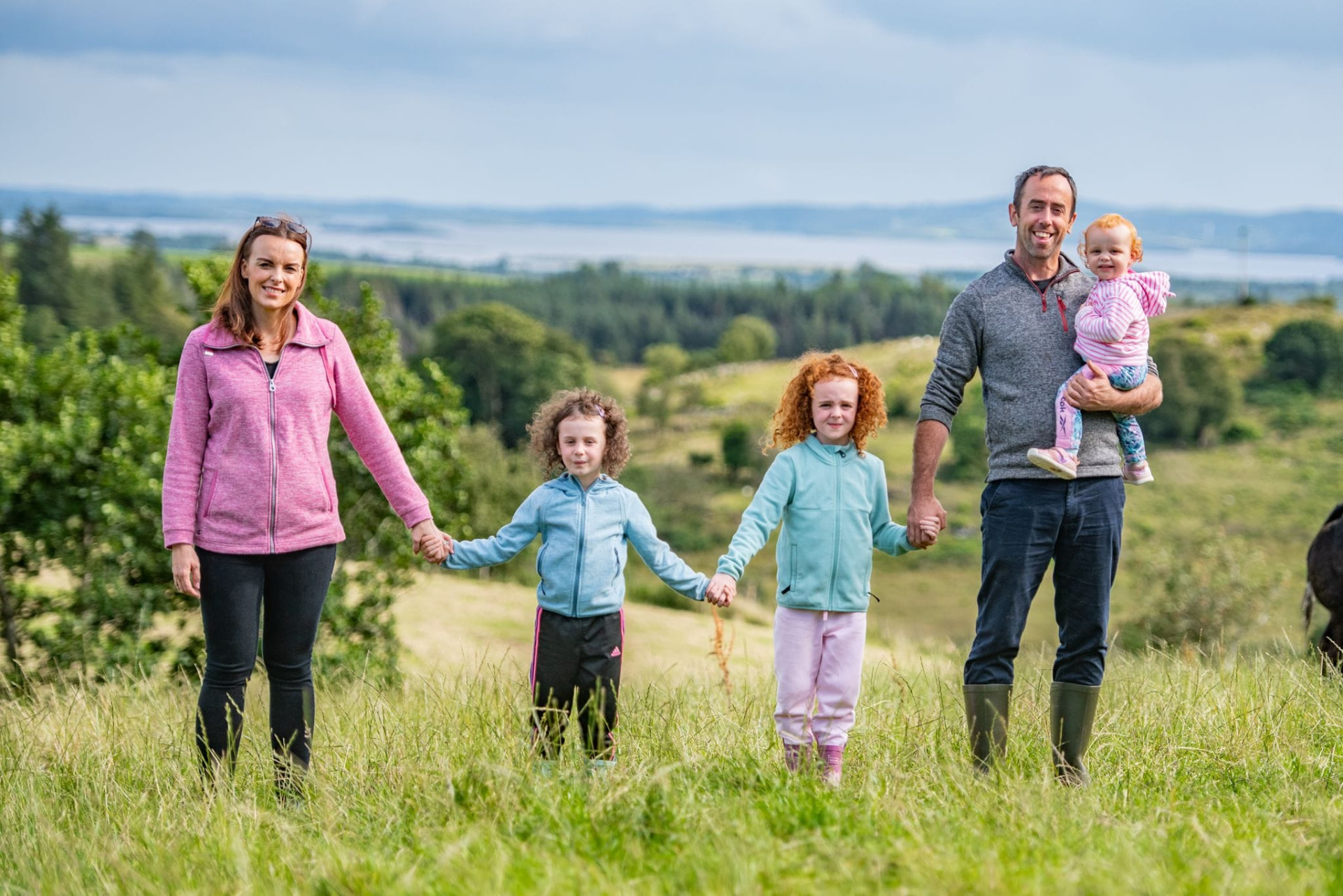 The McGee family walking through a field at Corlea Livestock in Donegal